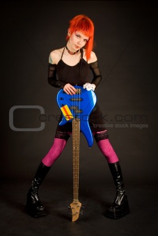 Romantic rock girl with bass guitar 
