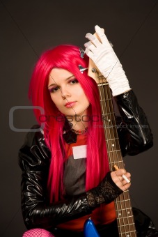 Portrait of a romantic girl with guitar