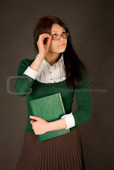 Businesswoman holding her glasses 