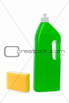 Yellow sponge and green bottle with dish soap