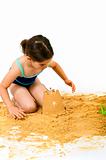 girl playing in the sand