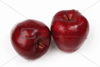 Two fresh apples with drops