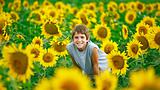 Teenager In A Sunflower Field