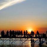 young people meeting sunset on sky background