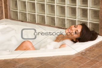 Attractive young gorges woman taking bath