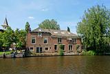 Dutch house, canal and trees