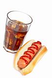 A hot dog and soda glass