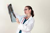 female doctor looking at a lungs x-ray
