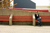 Woman on red bench