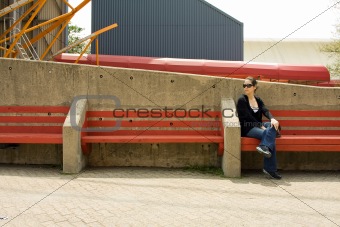 Woman on red bench
