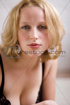 voluptuous blonde woman in black lace bra