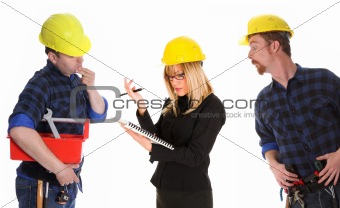 angry businesswoman and construction workers 