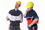 Two construction workers with architectural plans 