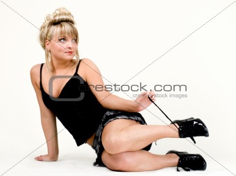 Sitting young woman holding a shoe lace