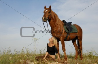 teen and horse in field