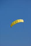 Yellow kite in the blue sky
