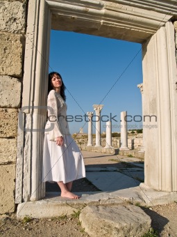 Barefoot Girl Leaning Ancient Ruins