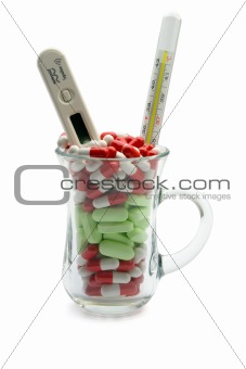 Glass full vitamin and two thermometers 
