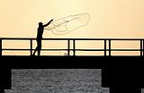 Fisherman tossing net