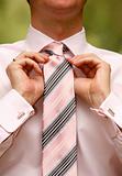 Man tying necktie