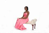 Teen in Pink Gown Sitting on Bench
