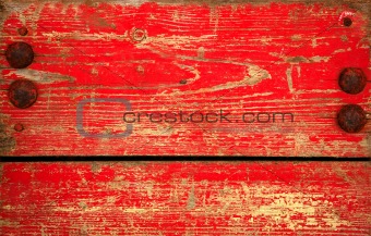 Red chipped paint on wood. Grunge background