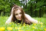 The Girl Lays On A Grass