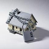 Miniature house with chains