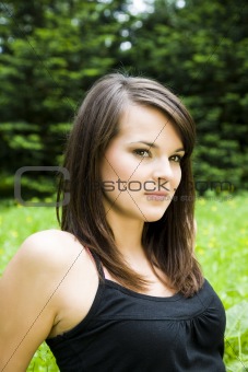 Pretty girl laying on the meadow