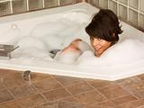 girl relaxing in foam bath