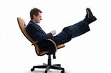 Young businessman relaxed in chair.