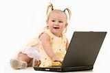 Adorable baby with laptop
