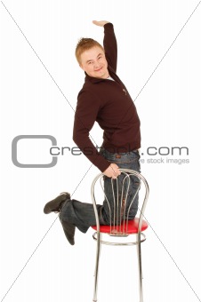 Joyful handsome guy on the chair