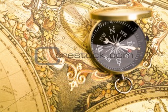 Compass on the old map background