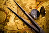 Old-fashioned compass on map