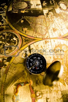 Old-fashioned compass on map