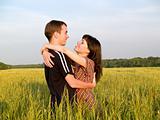 Teen Couple Embrasing in Field