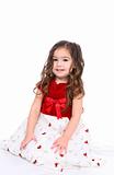 Pretty little girl in a red and white holiday dress