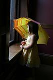 Little girl with yellow umbrella