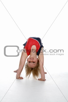 Young girl doing a gymnastics bridge position