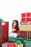 Little girl in holiday dress and presents