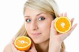 Beautiful girl with two slice juicy oranges