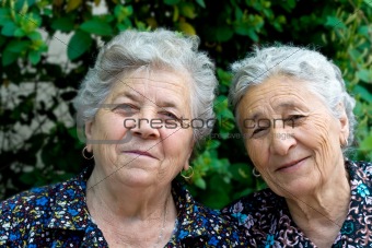 Portrait of two smiling old ladies