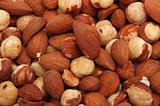 closeup picture of hazelnuts and almonds