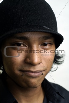 Smiling asian man with hat and red eyes