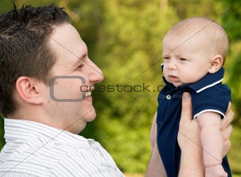 Father Holding Son Laughing