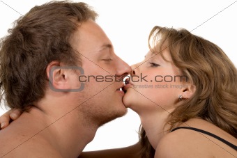 Portrait of young kissing couple. Isolated on white 2