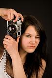 Attractive girl with retro camera
