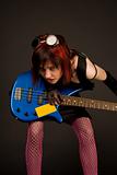 Sensual rock girl with bass guitar