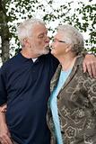 Older couple outside and in love